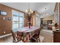 Charming dining room featuring beautiful windows, a decorative chandelier, and room for entertaining and gathering at 13506 Crystal River Dr, Orlando, FL 32828