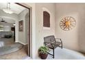 Inviting entryway with tiled floors, an ornate sun decoration, and a bench at 1382 Hayton Ave, Deland, FL 32724