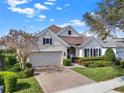 Beautiful home with a brick driveway, two-car garage, and well-maintained landscaping at 1382 Hayton Ave, Deland, FL 32724