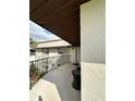 Cozy balcony area with seating, perfect for relaxing and enjoying the outdoor ambiance at 76 Windtree Ln # 201, Winter Garden, FL 34787