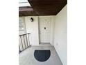 Inviting entryway with a neutral-colored door, providing a clean and welcoming entrance to the home at 76 Windtree Ln # 201, Winter Garden, FL 34787