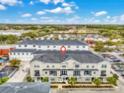 Charming townhome boasts multi-story balconies and well-maintained landscaping in a convenient location at 13042 Michael Callin Aly, Orlando, FL 32828