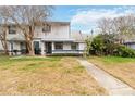 Charming two-story home with landscaped front yard and inviting entrance at 2635 Graduate Ct, Orlando, FL 32826