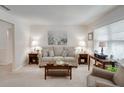 Inviting living room with neutral tones, a plush sofa, and abundant natural light at 301 Forest Ave, Altamonte Springs, FL 32701