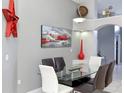 Well-decorated dining area with modern table and chairs, art, and decor at 7952 Heritage Entrance Blvd, Kissimmee, FL 34747