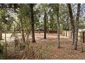 Large backyard with mature trees and wooden fence, offering plenty of privacy at 940 Douglas Ave # 170, Altamonte Springs, FL 32714