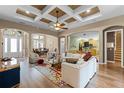 Spacious living room featuring high ceilings, hardwood floors, and a comfortable seating area at 1203 Gatwick Loop, Lake Mary, FL 32746