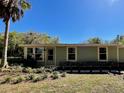 Charming single-story home showcasing its well-manicured front yard and appealing curb appeal at 171 Church St, Geneva, FL 32732
