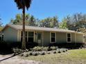 Charming single-story home showcasing its well-manicured front yard and appealing curb appeal at 171 Church St, Geneva, FL 32732