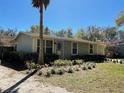 Charming single-story home showcasing its well-manicured front yard and appealing curb appeal at 171 Church St, Geneva, FL 32732
