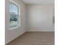 Bright living room featuring tile flooring and large windows that provide lots of natural light at 18046 Cider Mill Ln, Winter Garden, FL 34787