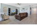 Spacious living room with ceiling fan, lots of natural light, and modern furnishings at 1972 Spring Shower Cir, Kissimmee, FL 34744