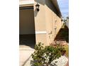 Side view of exterior with close up of exterior light fixture at 1972 Victoria St, Davenport, FL 33837
