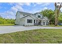 Charming home featuring a large driveway, two-car garage and manicured front lawn at 2650 Howard Ave, Oviedo, FL 32765
