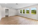 Spacious living room with hardwood floors, recessed lighting, and generous natural light at 2650 Howard Ave, Oviedo, FL 32765