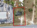 Aerial view of a property near commercial activity, featuring a generous lot size and mature tree coverage at 29650 State Road 19, Tavares, FL 32778