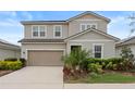 Charming two-story home features a well-maintained yard, neutral exterior paint and attached two car garage at 580 Buchannan Dr, Davenport, FL 33837