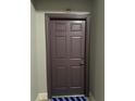 Unit 470's front entrance door is a solid, paneled design with modern hardware at 860 N Orange Ave # 470, Orlando, FL 32801