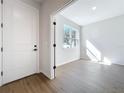 Bright office space with hardwood floors and natural light from the window at 1112 W Line St, Leesburg, FL 34748
