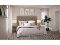 Bright and spacious bedroom with ample natural light and elegant decor. Modern lamps on either side of the bed at 167 Aulin Ave, Oviedo, FL 32765
