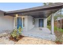 Inviting covered entryway with two front doors and gray flooring, perfect for a welcoming arrival at 1834 Willie Mays Pkwy, Orlando, FL 32811