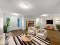 Bright living room with new flooring, neutral colors, and stylish furniture at 1834 Willie Mays Pkwy, Orlando, FL 32811