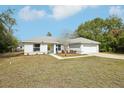 Charming single Gathering home featuring well-maintained landscaping and a two-car garage at 25 Maple Crse, Ocklawaha, FL 32179