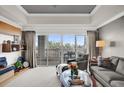 Cozy living room with balcony, perfect for relaxing and enjoying the view at 7613 Cabana Ct # 402, Reunion, FL 34747
