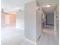 Bright hallway with white tile flooring leading to living spaces at 820 Rayston, Deltona, FL 32725
