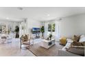 Bright and airy living room featuring neutral tones, modern furniture, and lots of natural light at 1074 Clay Blvd, Tavares, FL 32778