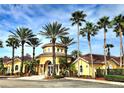 Elegant Villanova clubhouse with stately palm trees and ample parking at 12204 Wild Iris Way # 109, Orlando, FL 32837