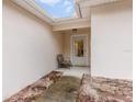 Charming entrance with a cozy chair, perfect for enjoying the outdoors at 195 Maple Dr, Kissimmee, FL 34759