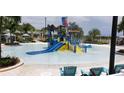 Fun water park featuring slides, a splash bucket, and shallow water for to play and splash at 2182 Cooper Bell Pl, Kissimmee, FL 34747