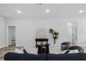 Bright living room with neutral color palette, stylish furnishings, and hardwood flooring at 2249 Sw 146 Loop, Ocala, FL 34473