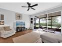 Cozy living room with ceiling fan opens to a screened lanai with a hammock for relaxation at 2851 Polvadero Ln # 107, Orlando, FL 32835