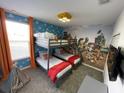 Charming bedroom with a bunk bed and fun, themed decor for a playful atmosphere at 695 Whistling Straits Blvd, Davenport, FL 33896