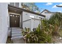 Welcoming front entry with double doors and a cozy, covered porch area at 910 Florida Blvd, Altamonte Springs, FL 32701