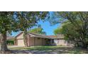 Inviting single-story home with manicured front yard and mature shade trees, displaying curb appeal at 1002 Royalton Rd, Orlando, FL 32825