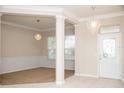 Open-concept living room with decorative lighting and neutral tones throughout at 11474 Claymont Cir, Windermere, FL 34786