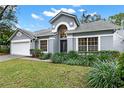 A charming single Gathering home with a well-manicured lawn and attractive landscaping features at 1341 American Elm Dr, Altamonte Springs, FL 32714