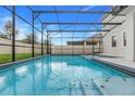 Sparkling screened pool with clear blue water and decorative floor tiles at 1472 Rushing Rapids Way, Winter Springs, FL 32708
