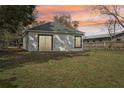 View of the backyard showing the exterior with white siding at 2206 W Pine St, Orlando, FL 32805