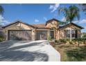 Charming single-story home with a three-car garage, well-manicured lawn, and beautiful landscaping at 32107 Spring Meadow Ct., Sorrento, FL 32776