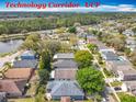 Technology Corridor UCF aerial view showcasing a residential neighborhood, pond, and green spaces at 4020 Shawn Cir, Orlando, FL 32826