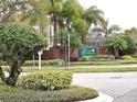 Community entrance sign for Tanner Crossings amid lush landscaping and palm trees, welcoming visitors at 4020 Shawn Cir, Orlando, FL 32826