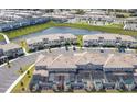 An aerial view of a townhome community, showcasing the pools and well-kept landscaping at 4844 Romeo Cir, Kissimmee, FL 34746