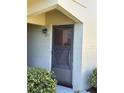 Close-up of front door with visible unit number, complemented by neat landscaping at 5505 Hernandes Dr # Ge, Orlando, FL 32808