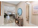 Inviting entryway with neutral tones, tile flooring, and decor at 1380 Patterson Ter, Lake Mary, FL 32746