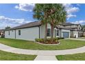 Attractive home with lush lawn, sidewalk access, and vibrant landscaping at 1380 Patterson Ter, Lake Mary, FL 32746