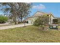 Nice single-story home with a well-manicured lawn and mature landscaping at 25239 Cranes Roost Cir, Leesburg, FL 34748